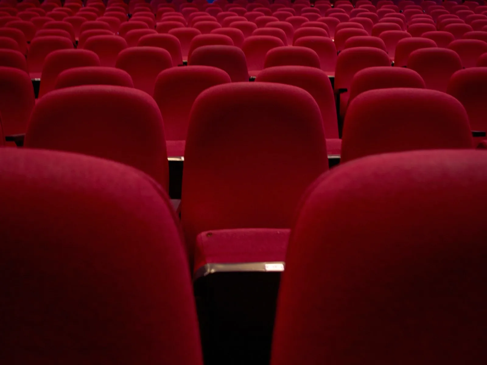Empty rows of seats in a cinema.